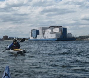 The Vernon C Bain Correction Center prison barge from a kayak.