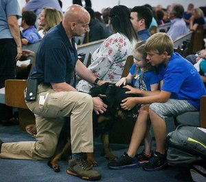 Author John Hunt & K-9 Gunther providing comfort to 2 young children impacted by the shooting event in Virginia Beach, May 2019.