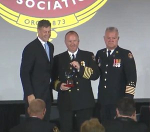 Left to right: Jim Johnson, Pierce Manufacturing president; Chief Marshall Turbeville; and IAFC President Ken Stuebing.