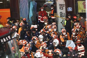 First responders gathered on Sunday, Oct. 30, 2022, in Seoul after huge crowds of people stampeded, according to authorities.
