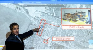 Rafael Grossi, director general of the International Atomic Energy Agency, points on a map of the Ukrainian Zaporizhzhia nuclear power plant as he informs the press about the situation of nuclear powerplants in Ukraine during a special press conference at the IAEA headquarters in Vienna, Austria on Friday..