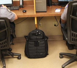 Cops don't carry briefcases. We carry backpacks.