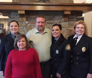 Paramedics Maull, Briggs and Wainwright (R) with cardiac arrest survivor James Lampe and wife Lana.