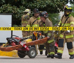 DC Fire Department move equipment into the garage at the Watergate complex after a structural collapse incident. (AP Photo/Jacquelyn Martin)