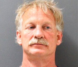 Gene Alan Carpenter, 54, is accused of flying a drone over a major Arizona wildfire.