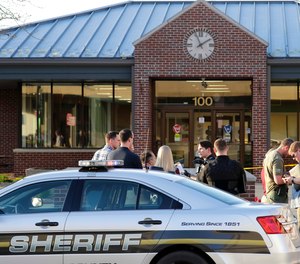 Authorities investigate the scene of a shooting at the Valley Transit Center in Appleton, Wis. Dan Powers/The Post-Crescent via AP)