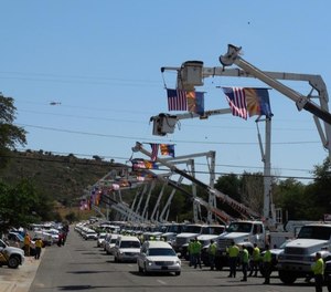 The funeral procession of the Granite Mountain Interagency Hotshot firefighters who lost their lives suppressing the Yarnell Fire passes through Yarnell, Arizona, on July 9, 2013.