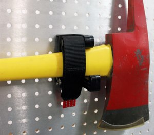 The SURE-GRIP tool mount provides quick access and is easy to operate, even with gloved hands. To release, just unfasten the strap, then pull and remove the tool.