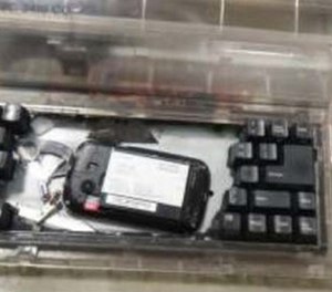 Investigators provided a photo of the cellphone hidden inside the typewriter.