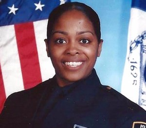 This undated photo provided by the New York Police Department shows officer Miosotis Familia, who was shot to death early Wednesday, July 5, 2017, ambushed inside a command post RV by an ex-convict, authorities said. The gunman was killed by police about a block away.