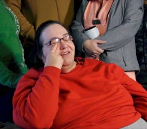 This Dec. 29, 2017 photo shows Lisa Finch, surrounded by family members reacting to the killing of her son Andrew Finch after he was shot by police, in Wichita, Kan. (Bo Rader /The Wichita Eagle via AP)