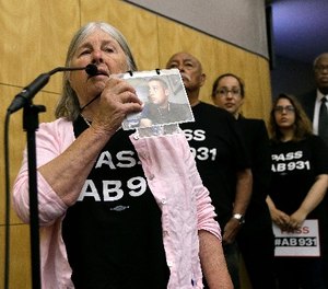 Patricia L. Perez speaks in support of a measure to limit police use of deadly force, during a hearing of the Senate Public Safety Committee, Tuesday, June 19, 2018, in Sacramento, Calif.