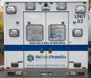 An Ada County Paramedics ambulance with the ABC's Safe Infant Sleep campaign.