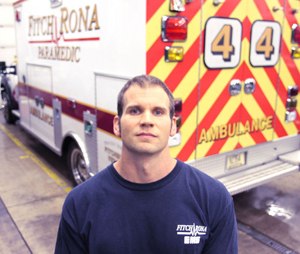 Paramedic Ross Williams is photographed in the Fitchburg Fire Department garage. Williams is the one who gained Andrew’s trust and carried him down the stairs at the Oneida Street house seven years ago. Andrew, which is no longer his name, remembers Williams. “That’s an honor,” Williams said.