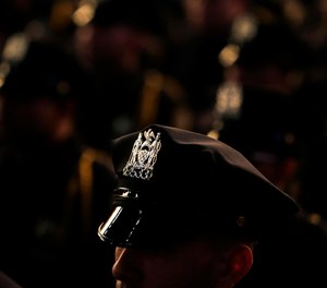 New graduates of the Police Academy participate in a graduation ceremony in New York, Wednesday, Dec. 28, 2016.