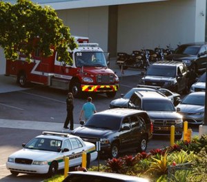 Police and rescue vehicles are shown outside Broward Health North hospital, Wednesday, Feb. 14, 2018, in Deerfield Beach, Fla. (AP Photo/Joe Skipper)
