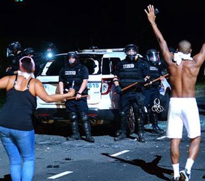Protesters approach police in Charlotte, N.C., Tuesday, Sept. 20, 2016.