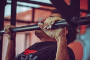The pull up is one of the best upper body exercises you can do to build grip strength and the adductor muscle groups. (Photo/Pexels)