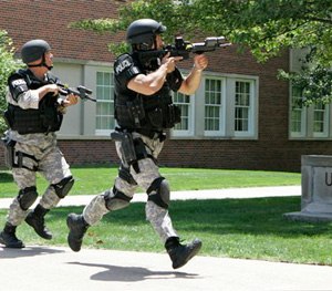Police officers from the Omaha Emergency Response Unit conduct
