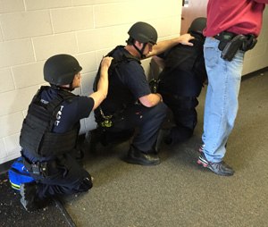 An RTF team of police officers and paramedics enters the warm zone to find, triage, and treat patients with life-threatening injuries.