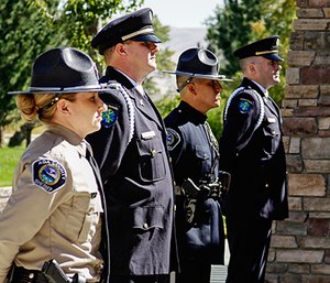 Ada County Paramedics Honor Guard members Robert Vander Stelt and Chris Ehrman stand with Ada County Sheriff representatives in a memorial cordon for Ada County Paramedics Donna Seller’s memorial service (Photo by Andrea Cobler)