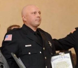 Officer Adam Zieminski at an awards ceremony.