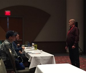 Rick Barney, MD is pictured speaking to attendees on addiction as a brain disease at Wis. EMS Association Conference.