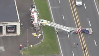 Pa. aerial tower flying American flag overturns onto roadway