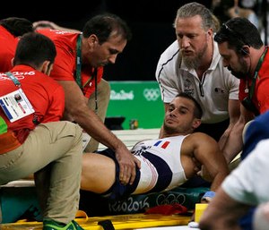 France's Samir Ait Said is assisted after injuring his leg in the vault, Saturday, Aug. 6, 2016. (AP Photo/Rebecca Blackwell)