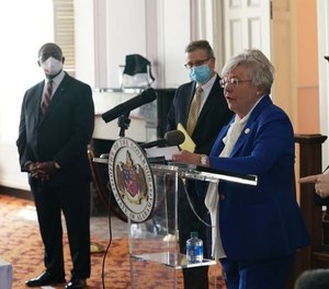 Gov. Kay Ivey announces the state's stay-at-home order on April 28, 2020. Sheriffs across Alabama have taken different approaches to enforcement, from refusal to enforcement to education or citation. (Photo/TNS)