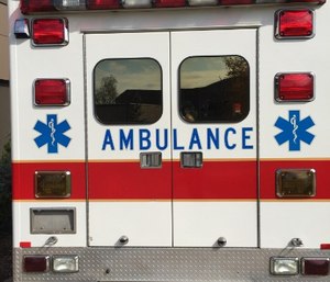 If you can, get the victim to the ambulance for their safety, as well as your own.