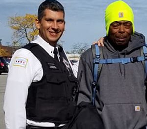 Pictured are Lt. John Garrido (left) and Anthony Johnson.