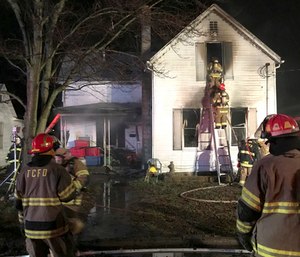 Three young siblings were killed and their mother was hospitalized after she tried to save them from a house fire. (Photo/AP)