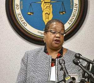 Wayne County Prosector Kym Worthy announces charges Monday, Oct. 1, 2018 in Detroit, against a police officer and two paramedics who have been charged with involuntary manslaughter in the death of a man who suffered convulsions in a suburban Detroit jail but wasn't taken to a hospital.