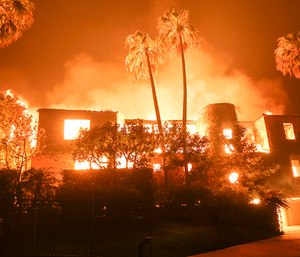 Six days after the Woolsey fire broke out, killing two people and burning more than 98,000 acres and growing, five engines from Washington State made their way to California to help fight the blaze. (Photo/AP)