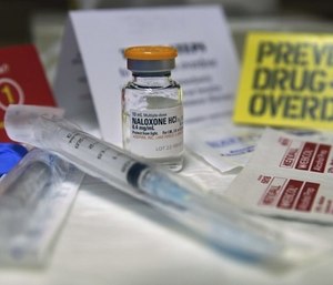 Seattle officials are advising people who use drugs to have naloxone on hand, which can be obtained at needle exchanges and other locations. (Photo/WBUR.org)