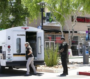 A Glendale police forensics investigator works at the scene of an active shooter situation at the Westgate Entertainment District. (Photo/TNS)