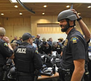 Officers try on Shield 616 gear.