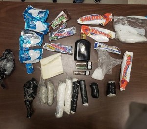 The drugs were wrapped inside of candy bar wrappers when investigators found them.