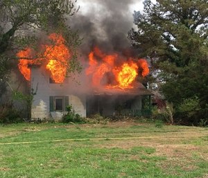 A firefighters organization claimed that fire officials endangered its members by burning a house that contained asbestos. (Photo/Virginia Beach Firefighters Association)