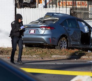 An Atlanta police officer responds to the scene of a fatal vehicle collision that ended a police pursuit. Atlanta police chief Erika Shields announced Friday officers won't be allowed to pursue vehicles until the department reviews its policies. (Photo/TNS)