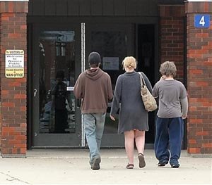 In this May 2, 2014 file photo people arrive to attend a community meeting on school safety at the Waseca Junior and Senior High School after a teenager accused of planning to massacre his family and high school classmates in Waseca, Minn.