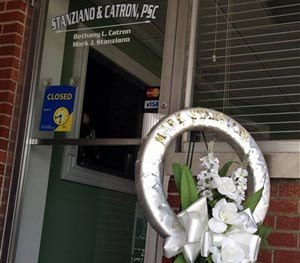 A memorial sits outside the office of defense attorney Mark Stanziano Friday morning, June 27, 2014, in Somerset, Ky. Somerset police say the 57-year-old Stanziano was shot and killed Friday morning outside his office. (AP Image)