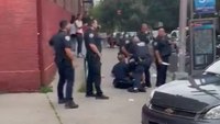 Video: NYPD cops pelted with glass bottles while trying to detain suspect