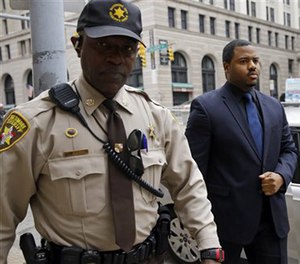 Officer William Porter, right, one of six Baltimore city police officers charged in connection to the death of Freddie Gray. (AP Image)