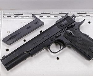 In this Nov. 26, 2014, file photo, a fake handgun resembling a Colt 1911 pistol, taken from Tamir Rice after he was fatally shot by Cleveland police, is displayed after a news conference in Cleveland.