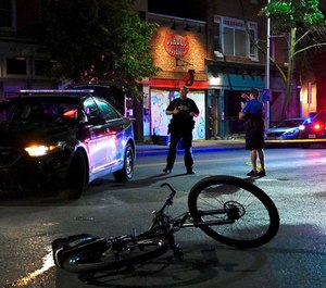 Baltimore Police investigate at a crime scene in Federal Hill where an officer was shot.