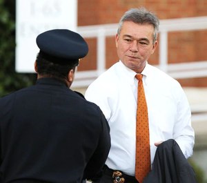 Executive Director of Public Safety James Barber, right, attends a public visitation for Mobile Police Officer Sean Tuder at Dauphin Way Baptist Church on Thursday, Jan. 24, 2019, in Mobile, Ala.