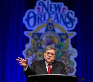 United States Attorney General William Barr, addresses the Grand Lodge Fraternal Order of Police's 64th National Biennial Conference at the Ernest N. Morial Convention Center on Convention Blvd. in New Orleans, La. Monday, Aug. 12, 2019. (David Grunfeld/The Advocate via AP)