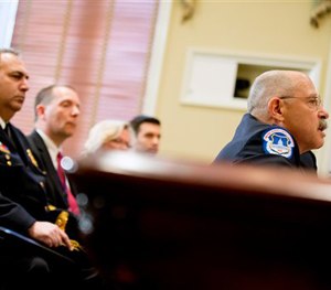 U.S. Capitol Police Chief Kim Dine, right, testifies on Capitol Hill in Washington, Wednesday, May 20, 2015.